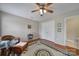 The bedroom features wood floors and a view of the ensuite bathroom at 2935 Dairy Farm Dr, Monroe, NC 28110