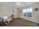 Well-lit bedroom featuring carpet flooring and neutral paint at 2935 Dairy Farm Dr, Monroe, NC 28110