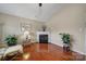 Bright living room showcasing a fireplace, hardwood floors, and natural light at 2935 Dairy Farm Dr, Monroe, NC 28110