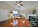 Cozy living room with hardwood floors, fireplace, and a vaulted ceiling at 2935 Dairy Farm Dr, Monroe, NC 28110