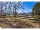 Spacious backyard with view of home and trees at 3019 Parkstone Dr, Charlotte, NC 28210