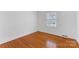 Bright bedroom with hardwood floors and large window at 3019 Parkstone Dr, Charlotte, NC 28210