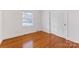 Bedroom featuring hardwood floors and closet at 3019 Parkstone Dr, Charlotte, NC 28210