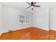 Bedroom with hardwood floors, window, and double doors at 3019 Parkstone Dr, Charlotte, NC 28210