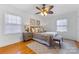 Bright bedroom with hardwood floors and ceiling fan at 3019 Parkstone Dr, Charlotte, NC 28210