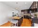 Modern kitchen with granite island, stainless steel appliances and dark cabinetry at 3019 Parkstone Dr, Charlotte, NC 28210