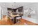 Kitchen with granite island, dark cabinetry, and breakfast nook at 3019 Parkstone Dr, Charlotte, NC 28210