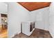 Laundry room with white cabinets, wood ceiling, and tile flooring at 3019 Parkstone Dr, Charlotte, NC 28210