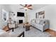 Cozy living room featuring fireplace and ample natural light at 3019 Parkstone Dr, Charlotte, NC 28210