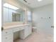 Bathroom features a vanity, skylight, and a view of the walk-in shower at 3041 Valencia Ter, Charlotte, NC 28211