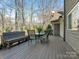 Relaxing outdoor deck with seating area and view of the wooded backyard at 3041 Valencia Ter, Charlotte, NC 28211