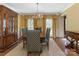 Well-lit dining room with hardwood floors, chandelier, and adjacent built-in cabinet at 3041 Valencia Ter, Charlotte, NC 28211