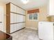 Functional laundry room with ample storage and a window at 3041 Valencia Ter, Charlotte, NC 28211