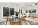 Modern dining area with glass table and sliding glass doors to patio at 3108 Amay James Ave, Charlotte, NC 28208