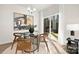 Bright dining area with glass table and view of backyard at 3108 Amay James Ave, Charlotte, NC 28208