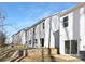 Rear view of townhomes with private decks and fenced yards at 3108 Amay James Ave, Charlotte, NC 28208