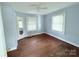 Bedroom with hardwood floors, light blue walls, and two windows at 350 Turnersburg Hwy, Statesville, NC 28625