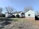 Rear view of a charming white house with a large backyard at 350 Turnersburg Hwy, Statesville, NC 28625