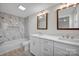 Double vanity bathroom with marble tile and modern fixtures at 400 E 27Th St, Kannapolis, NC 28083