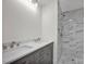 Bathroom boasts double vanity and marble shower at 400 E 27Th St, Kannapolis, NC 28083