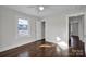 Hardwood floors and an open closet are featured in this bedroom at 400 E 27Th St, Kannapolis, NC 28083