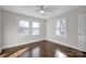 Well-lit bedroom featuring hardwood floors and two windows at 400 E 27Th St, Kannapolis, NC 28083