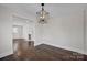 Dining area with hardwood floors and modern light fixture at 400 E 27Th St, Kannapolis, NC 28083