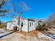 Side view of the house showcasing its siding and landscaping at 400 E 27Th St, Kannapolis, NC 28083