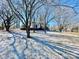 House exterior with trees and light dusting of snow on the ground at 400 E 27Th St, Kannapolis, NC 28083