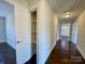 Bright hallway with hardwood floors and built-in shelving at 400 E 27Th St, Kannapolis, NC 28083