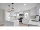 White kitchen with stainless steel appliances and island at 400 E 27Th St, Kannapolis, NC 28083