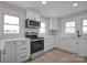 Renovated kitchen featuring white cabinets and stainless steel appliances at 400 E 27Th St, Kannapolis, NC 28083