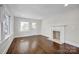 Living room with hardwood floors, fireplace, and French doors at 400 E 27Th St, Kannapolis, NC 28083