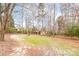 Spacious backyard with mature trees and small shed at 4025 Weddington Manor Ct, Matthews, NC 28104