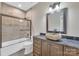 Bathroom with soaking tub, stone sink, and modern vanity at 4025 Weddington Manor Ct, Matthews, NC 28104