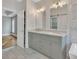 Bathroom with double vanity and marble flooring, and barn door at 4025 Weddington Manor Ct, Matthews, NC 28104