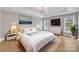 Main bedroom with light walls, hardwood floors and neutral decor at 4025 Weddington Manor Ct, Matthews, NC 28104