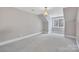 Bright bedroom featuring a large window and neutral carpeting at 4025 Weddington Manor Ct, Matthews, NC 28104