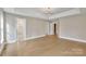 Spacious main bedroom with hardwood floors and ensuite bathroom access at 4025 Weddington Manor Ct, Matthews, NC 28104