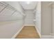 Large walk-in closet with wire shelving and hanging rods at 4025 Weddington Manor Ct, Matthews, NC 28104