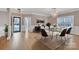 Elegant dining room featuring hardwood floors and a chandelier at 4025 Weddington Manor Ct, Matthews, NC 28104