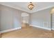 Elegant dining room featuring hardwood floors and an arched entryway at 4025 Weddington Manor Ct, Matthews, NC 28104