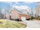 Brick home with a two-car garage and manicured lawn at 4025 Weddington Manor Ct, Matthews, NC 28104