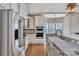 Modern kitchen with stainless steel appliances and farmhouse sink at 4025 Weddington Manor Ct, Matthews, NC 28104