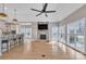 Open concept kitchen and Gathering room with hardwood floors and stone fireplace at 4025 Weddington Manor Ct, Matthews, NC 28104