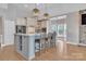 Renovated kitchen with large island and stainless steel appliances at 4025 Weddington Manor Ct, Matthews, NC 28104