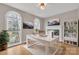 Home office with built-in shelves, fireplace and hardwood floors at 4025 Weddington Manor Ct, Matthews, NC 28104