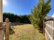 Landscaped backyard with wooden fence at 5052 Haven Lodge Rd, Matthews, NC 28104