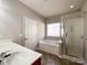 Bathroom with soaking tub and shower at 5052 Haven Lodge Rd, Matthews, NC 28104