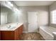 Double vanity bathroom with soaking tub at 5052 Haven Lodge Rd, Matthews, NC 28104